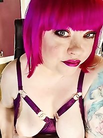 Red hair, curvaceous body.