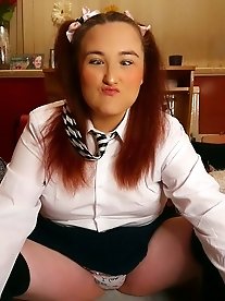 A fat British woman with big boobs gets fingered and makes cum face